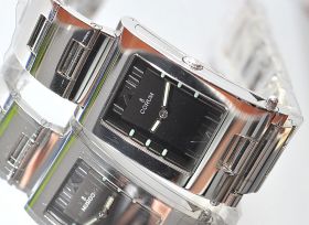 Corum "Tabogan" Ref.56-151-20 manual winding with folding assymetrical case in Steel