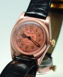 Rare Rolex Circa 1945, Ref.3696 32mm Oyster Perpetual Chronometer Self-winding "Bubble-back" Tropical in 9KRG 3pc case
