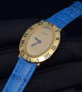 C.1970s Cartier vintage elliptical shaped manual winding in 18KYG with enamelled Roman numbers