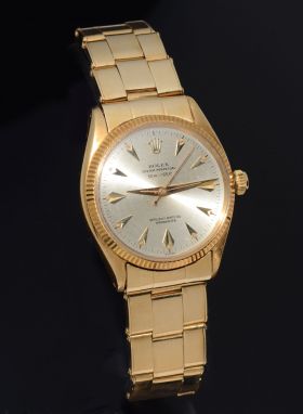 C.1955 Rolex 34mm Oyster Perpetual Chronometer 50 meter depth rating dial Ref.6567 Millerighe bezel in 18KYG + spring Bracelet